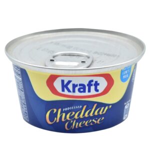Image of processed cheddar cheese inside a metal can.